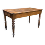 Old kitchen table with chopping board.