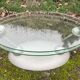 Design coffee table Naos in tempered glass and cast iron.