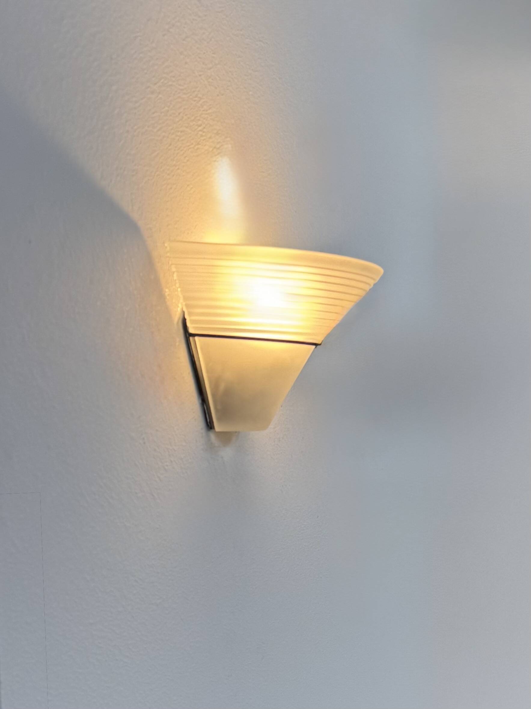 Frosted glass and black metal wall light, Italy, 1980.