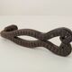 Antique wrought iron door handle with chiselled design.