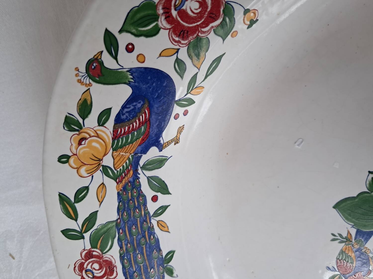 Large oval white ceramic platter, decorated with peacocks and vintage flowers