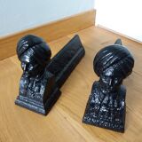 Cast iron andirons with character heads