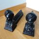Cast iron andirons with character heads