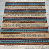 Multicolored hand-woven Berber rugs in natural wool