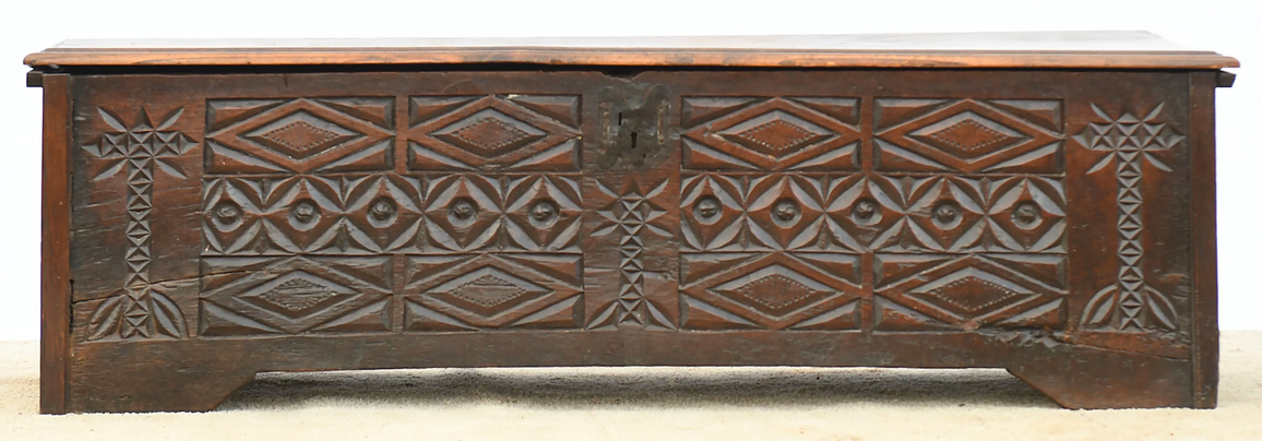 Antique chest in carved wood