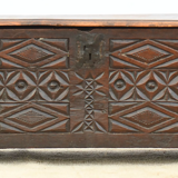 Antique chest in carved wood