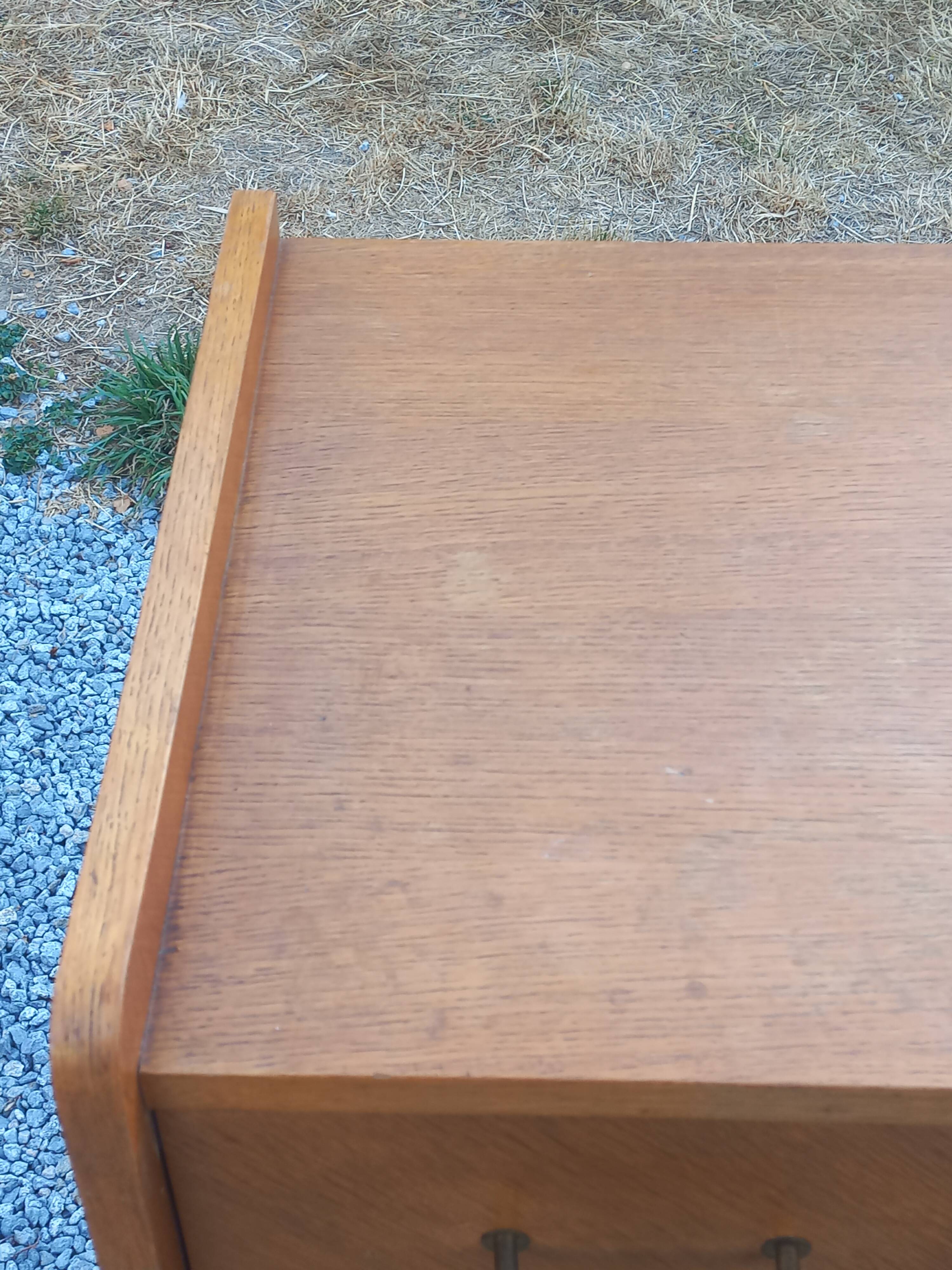 Commode vintage en chêne blond pieds compas 4 tiroirs 1950