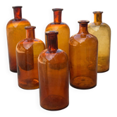 Set of 6 antique amber glass apothecary bottles.