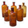 Set of 6 antique amber glass apothecary bottles.