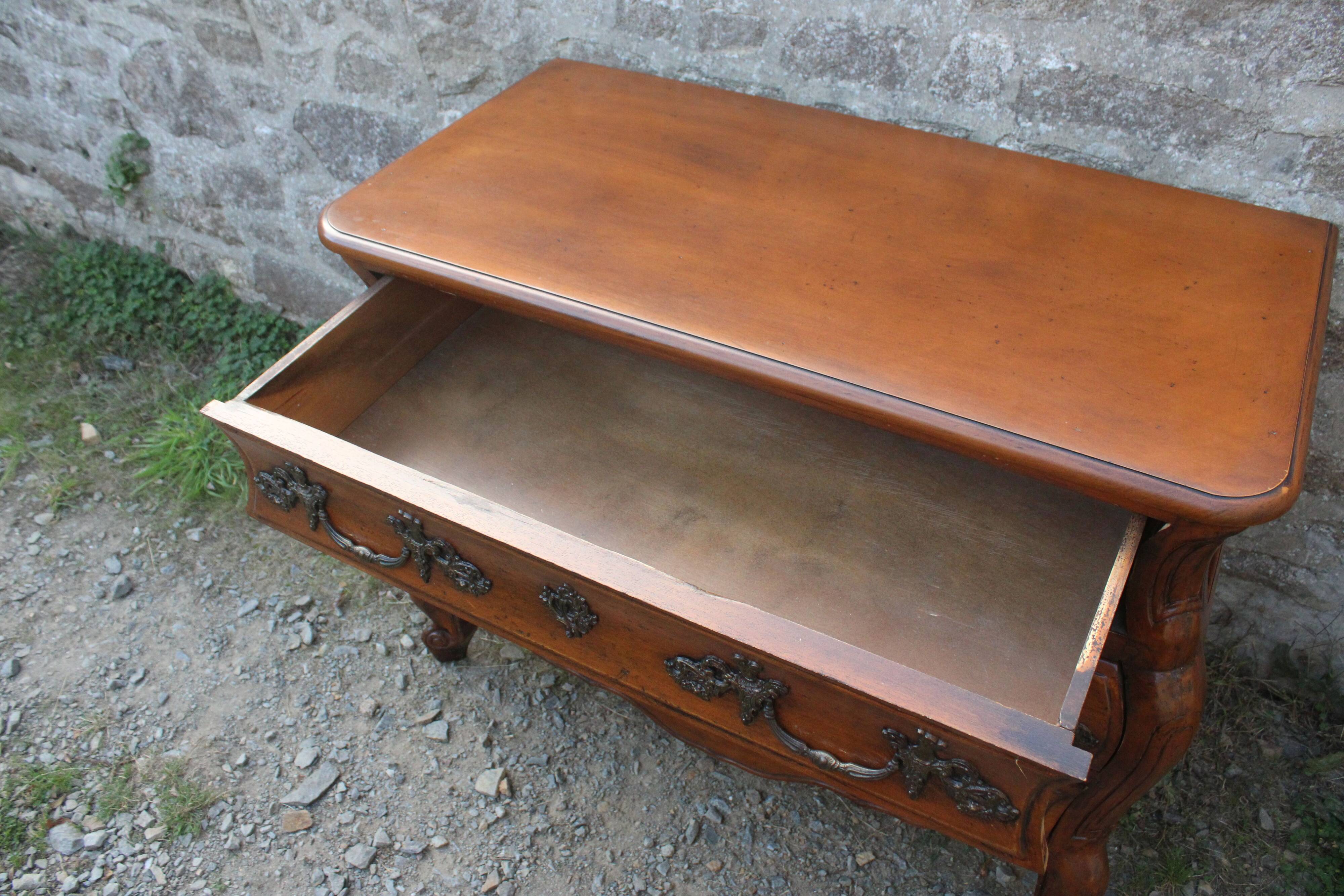 Curved Louis XV style chest of drawers known as a “tomb”
