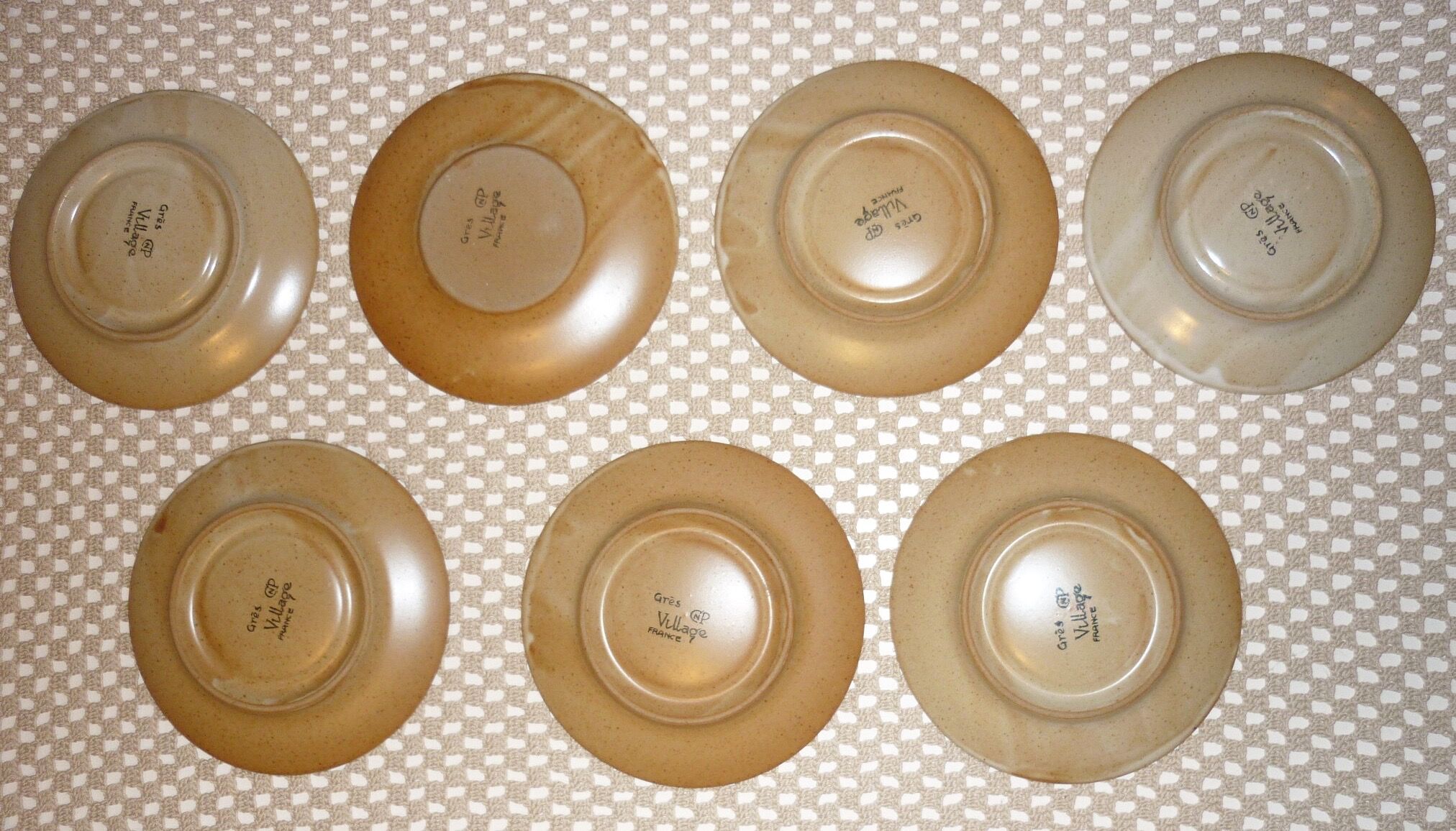 Pair of CNP Village France stoneware saucers