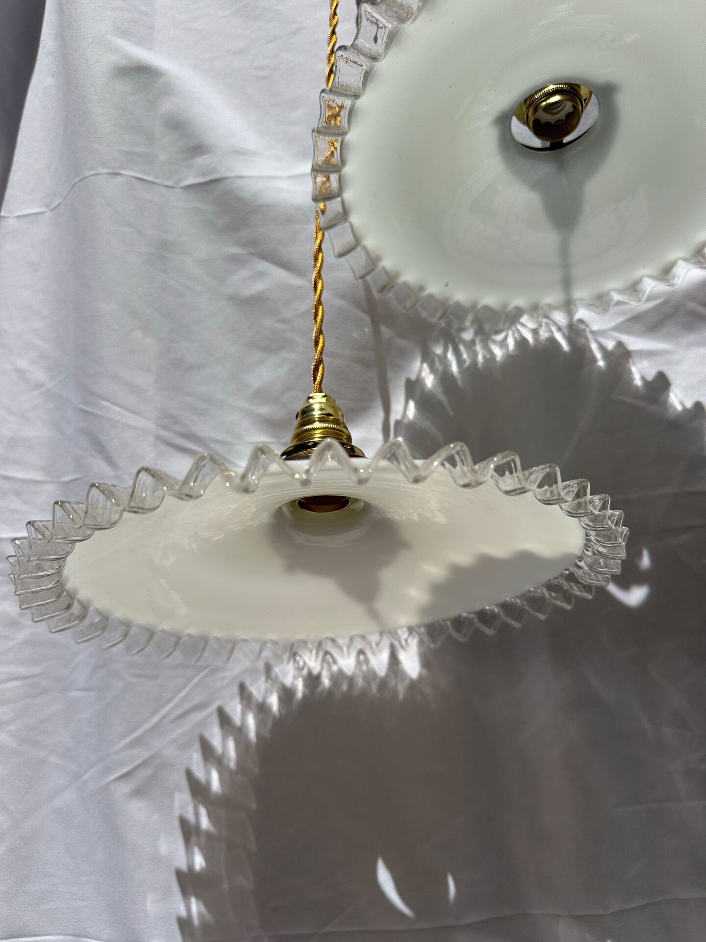 Vintage wavy opaline suspension pair with brass claw