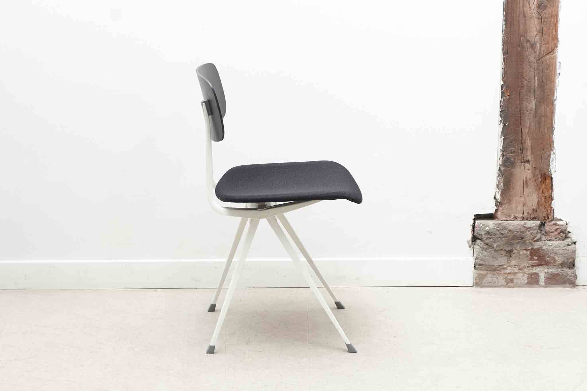 Friso Kramer "Result" chair upholstered in black and white.