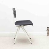 Friso Kramer "Result" chair upholstered in black and white.