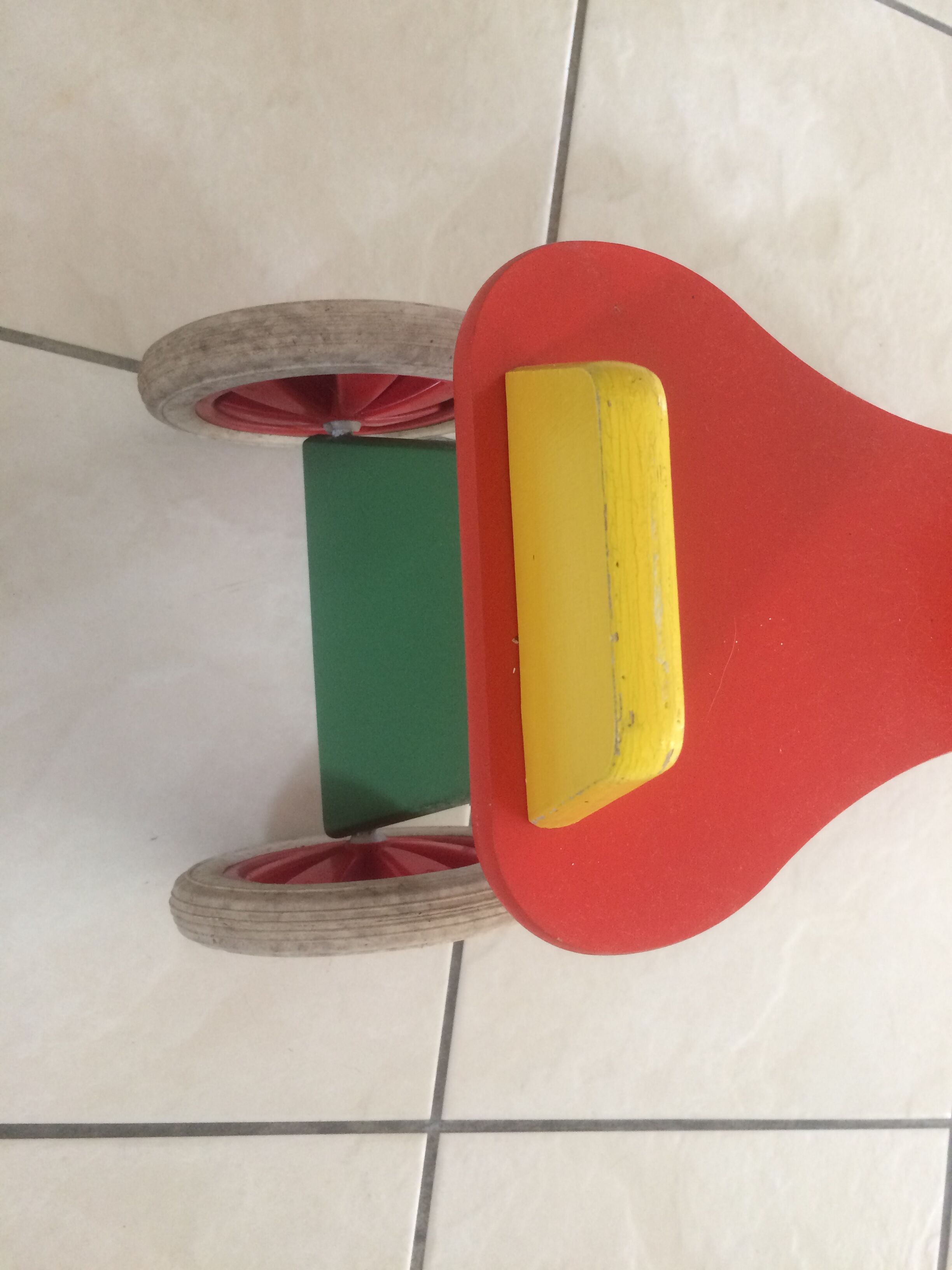 Colourful wooden 4-wheeled cycle. End of the 1970s.