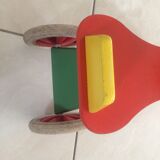 Colourful wooden 4-wheeled cycle. End of the 1970s.