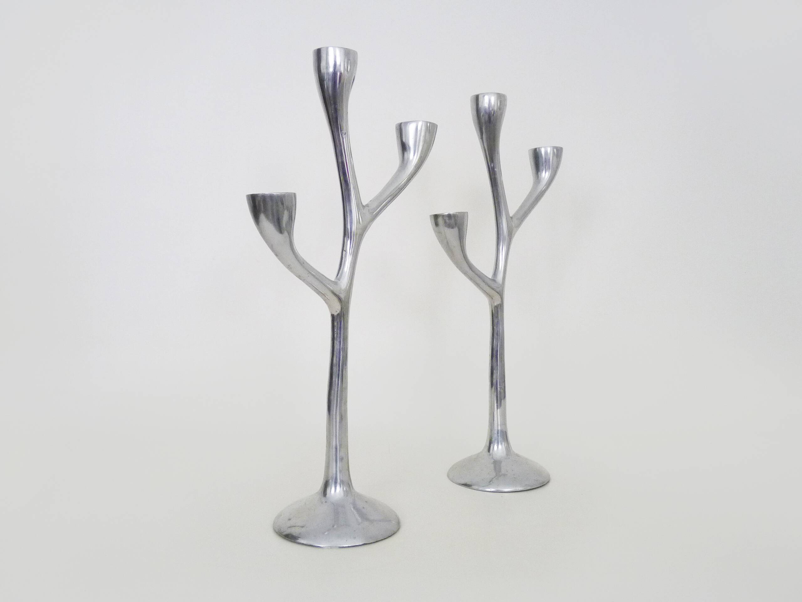 Pair of Italian "Tree" candlesticks in cast aluminum from the 80s
