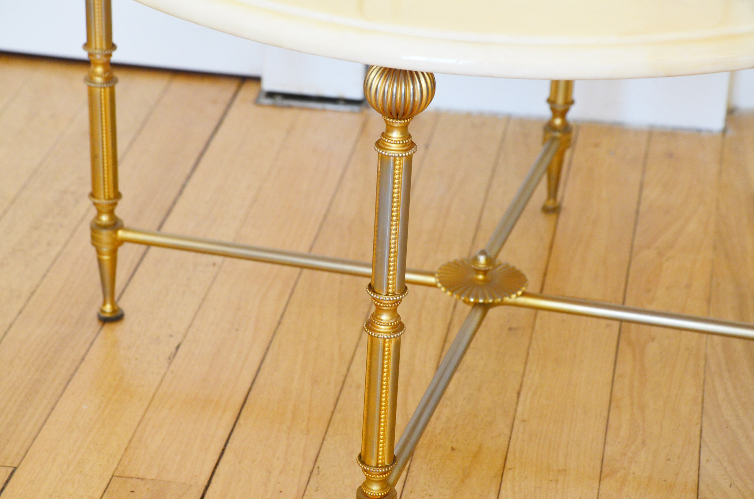 Round coffee table in 1960s neoclassical marble style