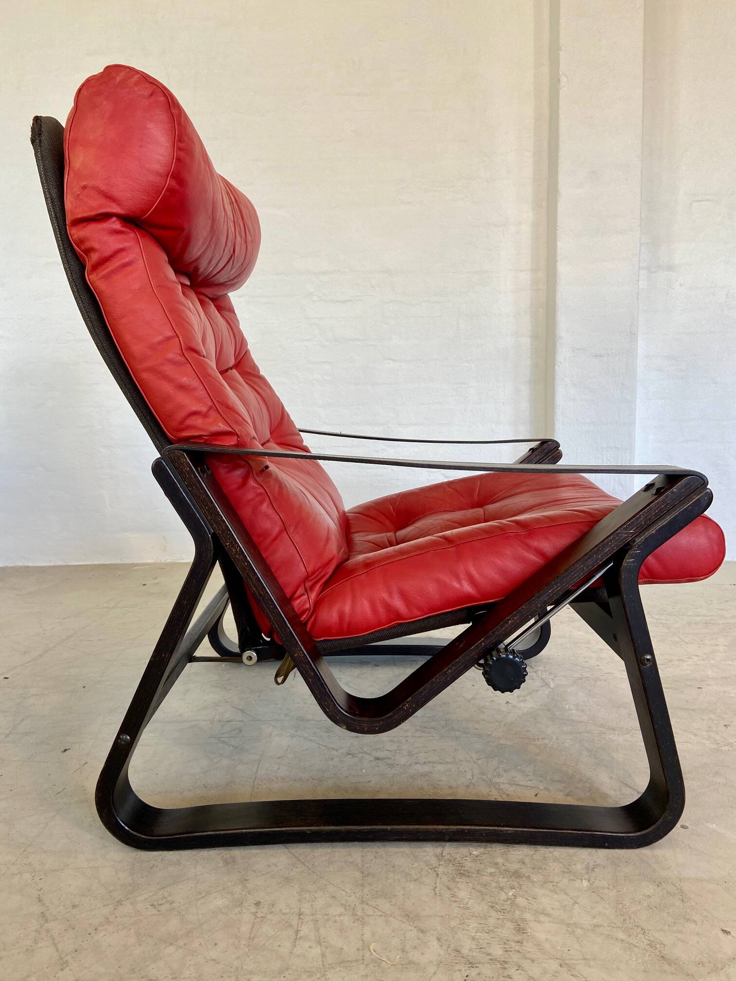 Vintage danish retro reclining lounge chair & stool in red leather by komfo