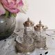 Salt, pepper and mustard shaker set in chiseled glass and silver metal