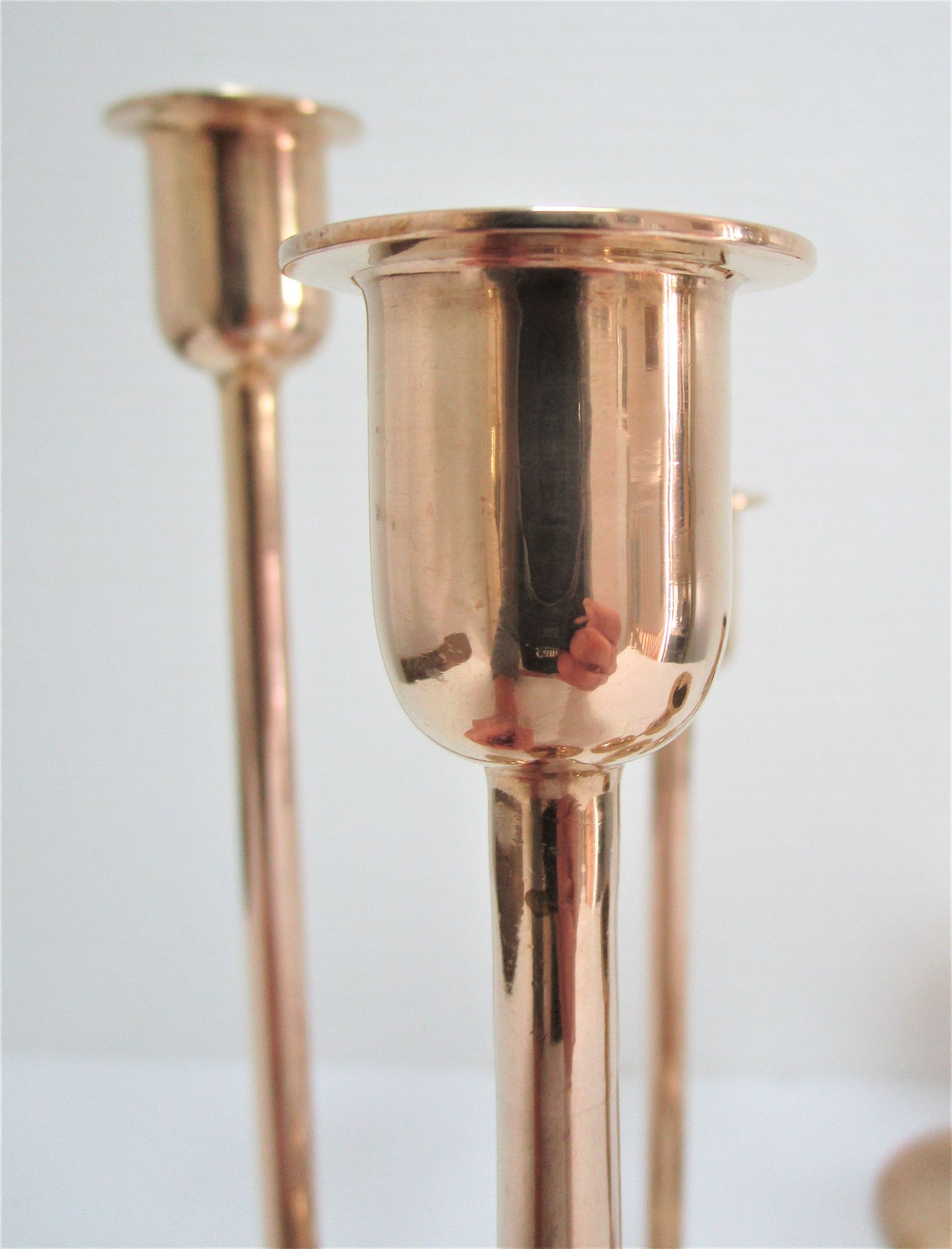 Series of seven candle holders solid brass