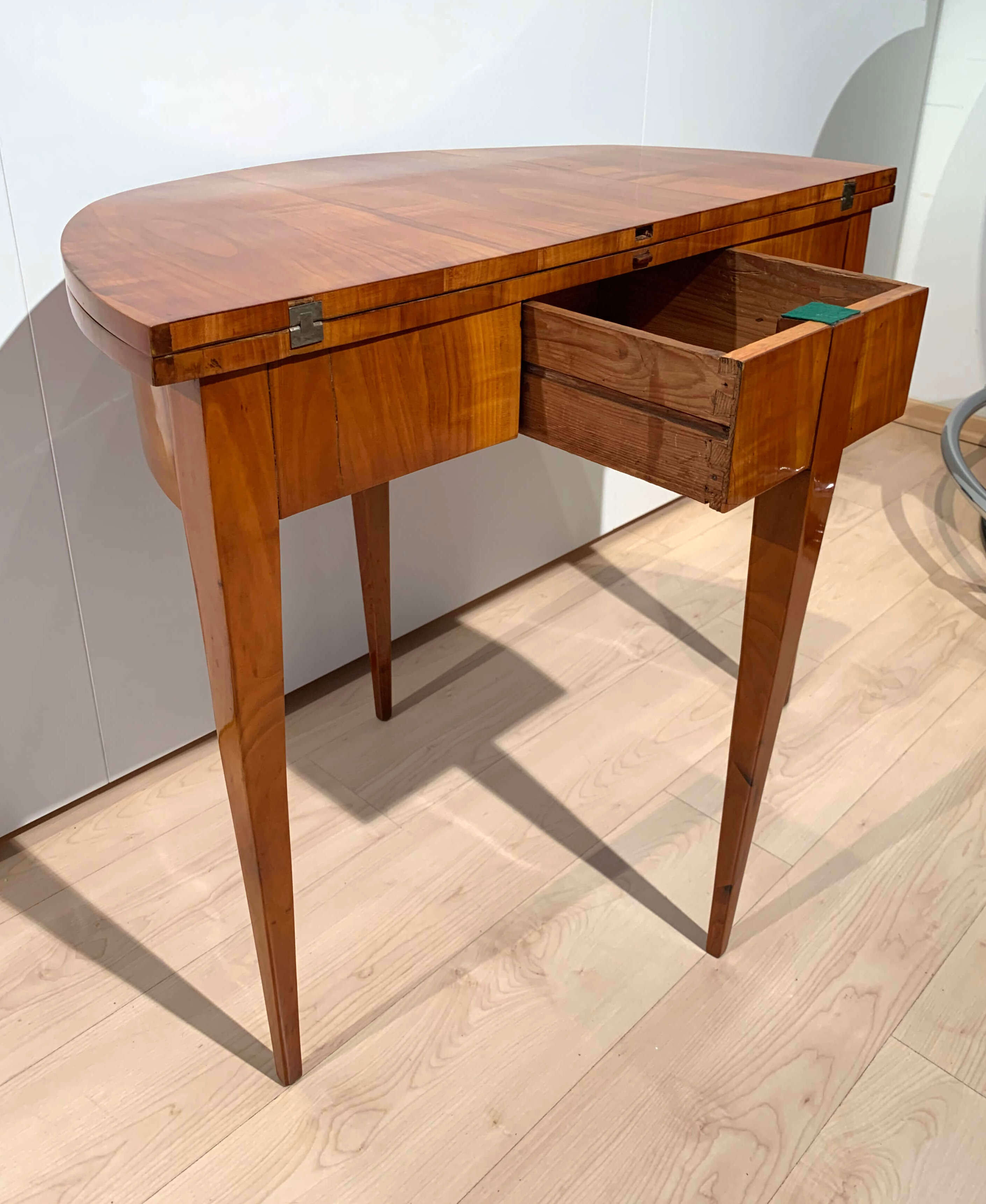 Biedermeier demi-lune fold-out table, cherry veneer, south germany, circa 1820