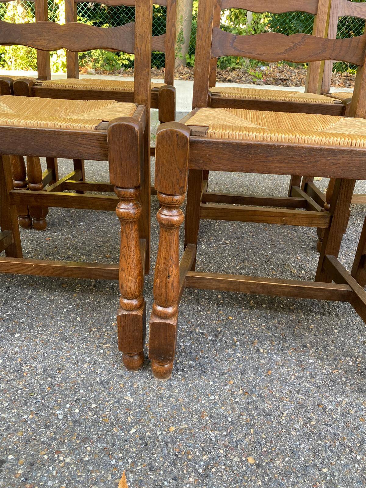 8 solid oak chairs in medium oak with straw, farmhouse style, high back.