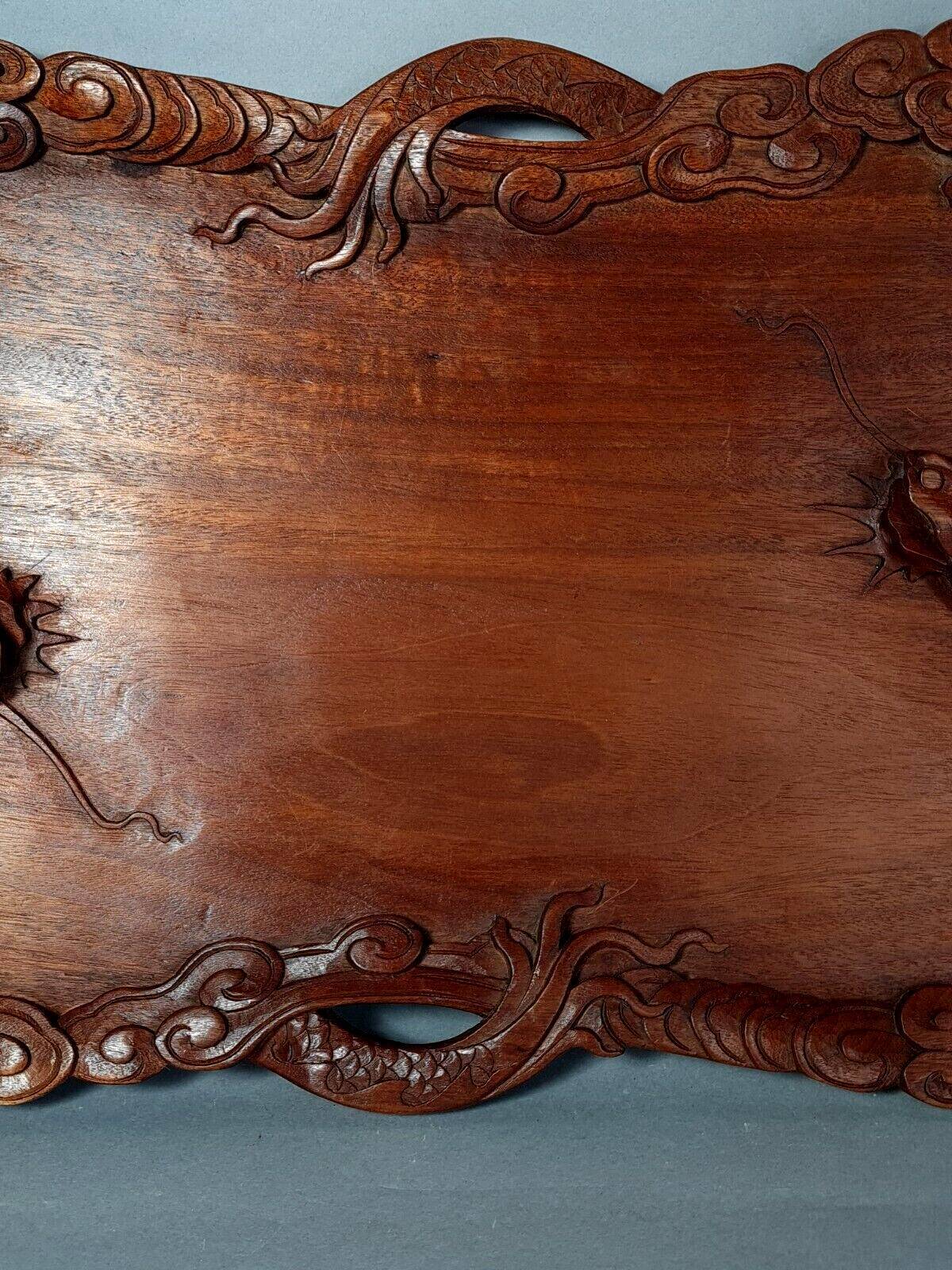 Ancient wooden tray carved with Chinese dragons around 1900