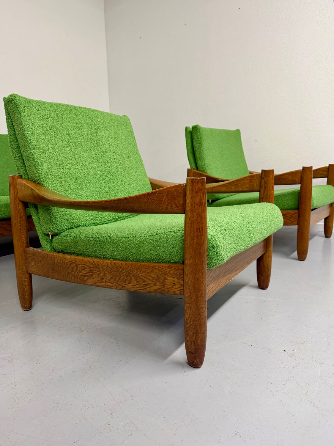 Living room sofa and Scandinavian design armchairs from the 1960s in green boucle.