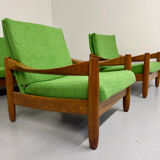 Living room sofa and Scandinavian design armchairs from the 1960s in green boucle.