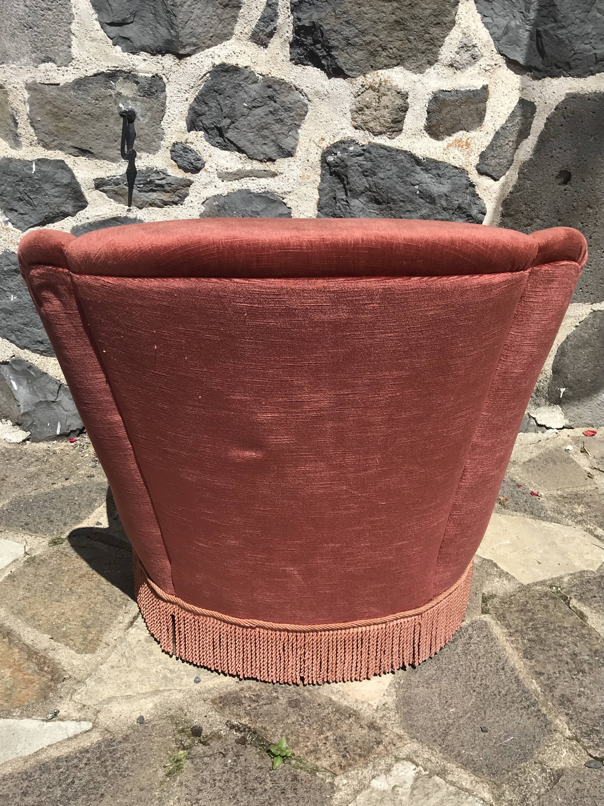 Vintage pink velvet armchair with fringes