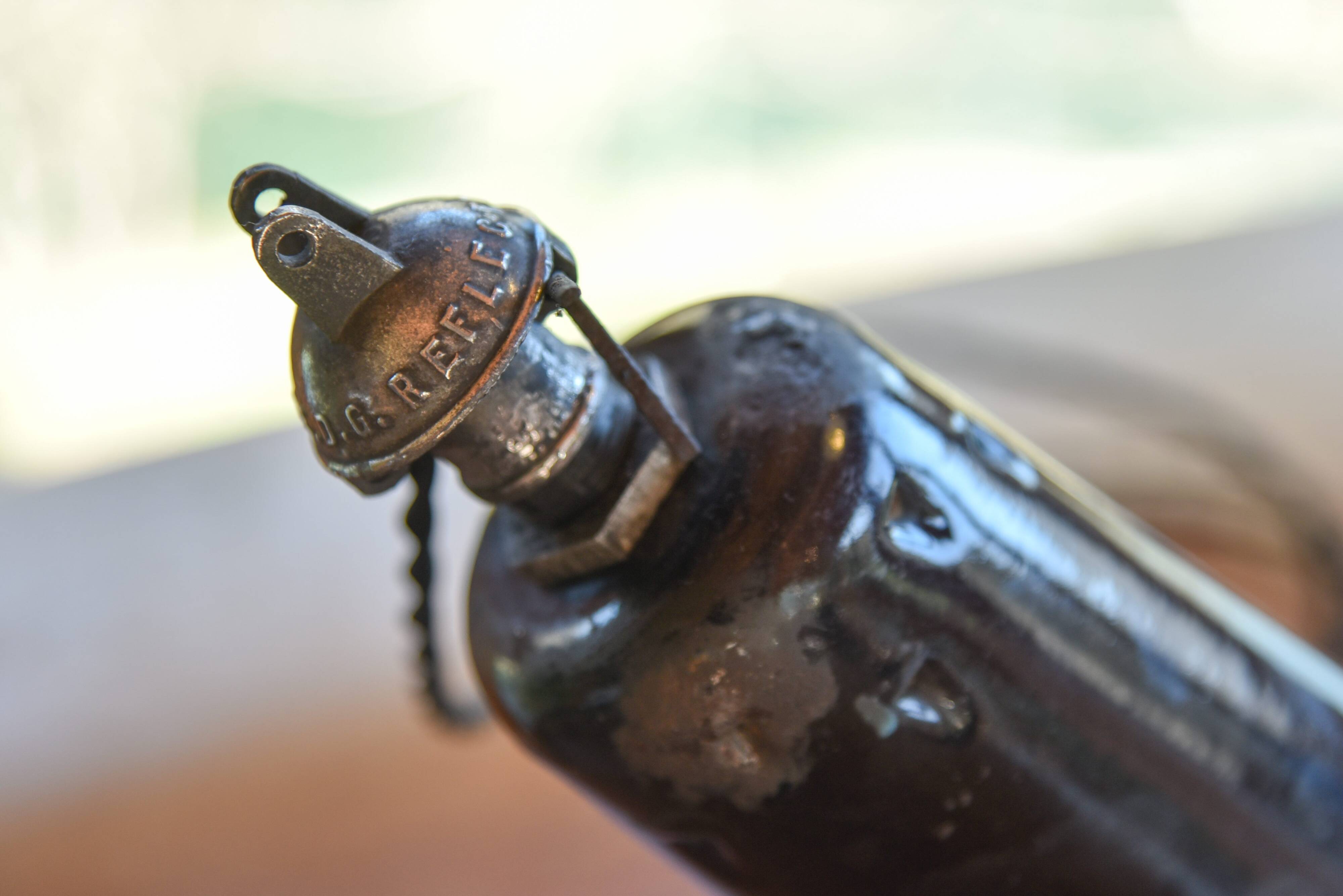 Pair of black enamelled sheet metal pendant lights from the 1950s.