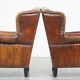 Set of 2 sheep leather wingback chairs with red corduroy seat cushions