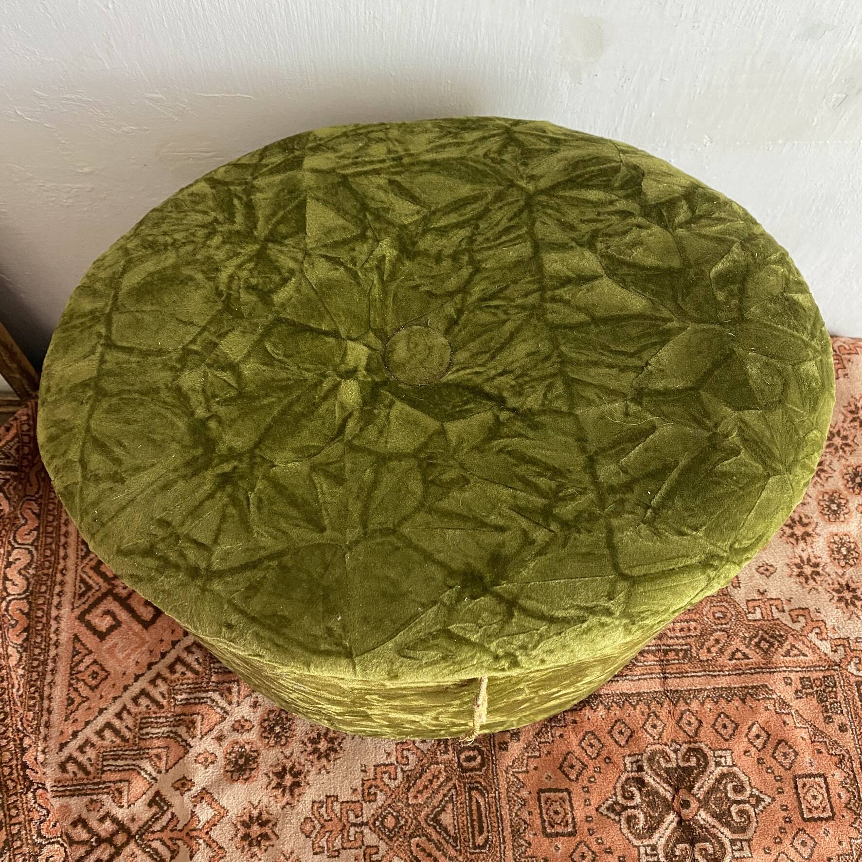 Green velvet storage pouffe from the 1960s.