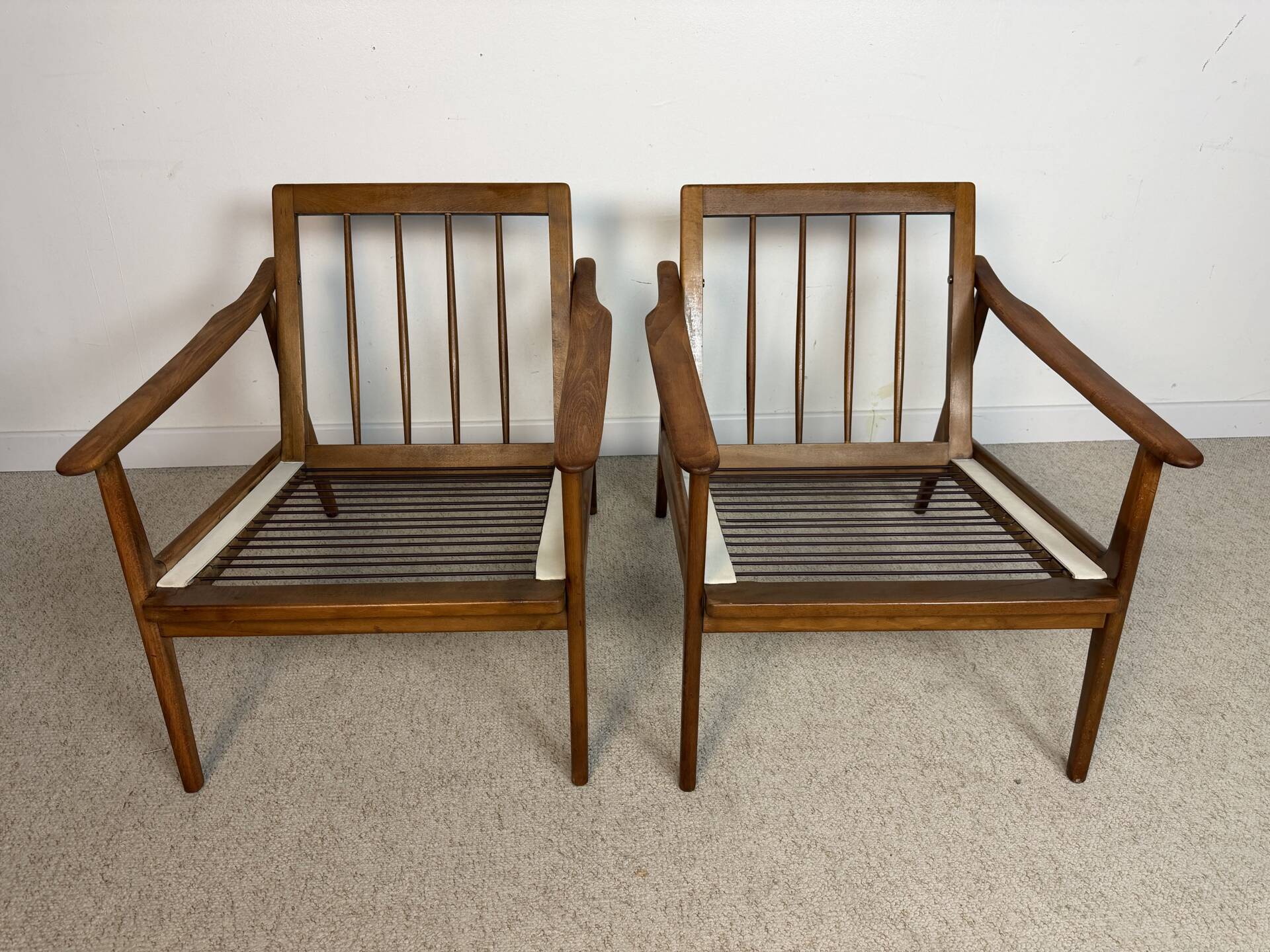a pair of Scandinavian armchairs in teak from the 1960s