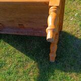 Solid oak coffee table with turned legs.