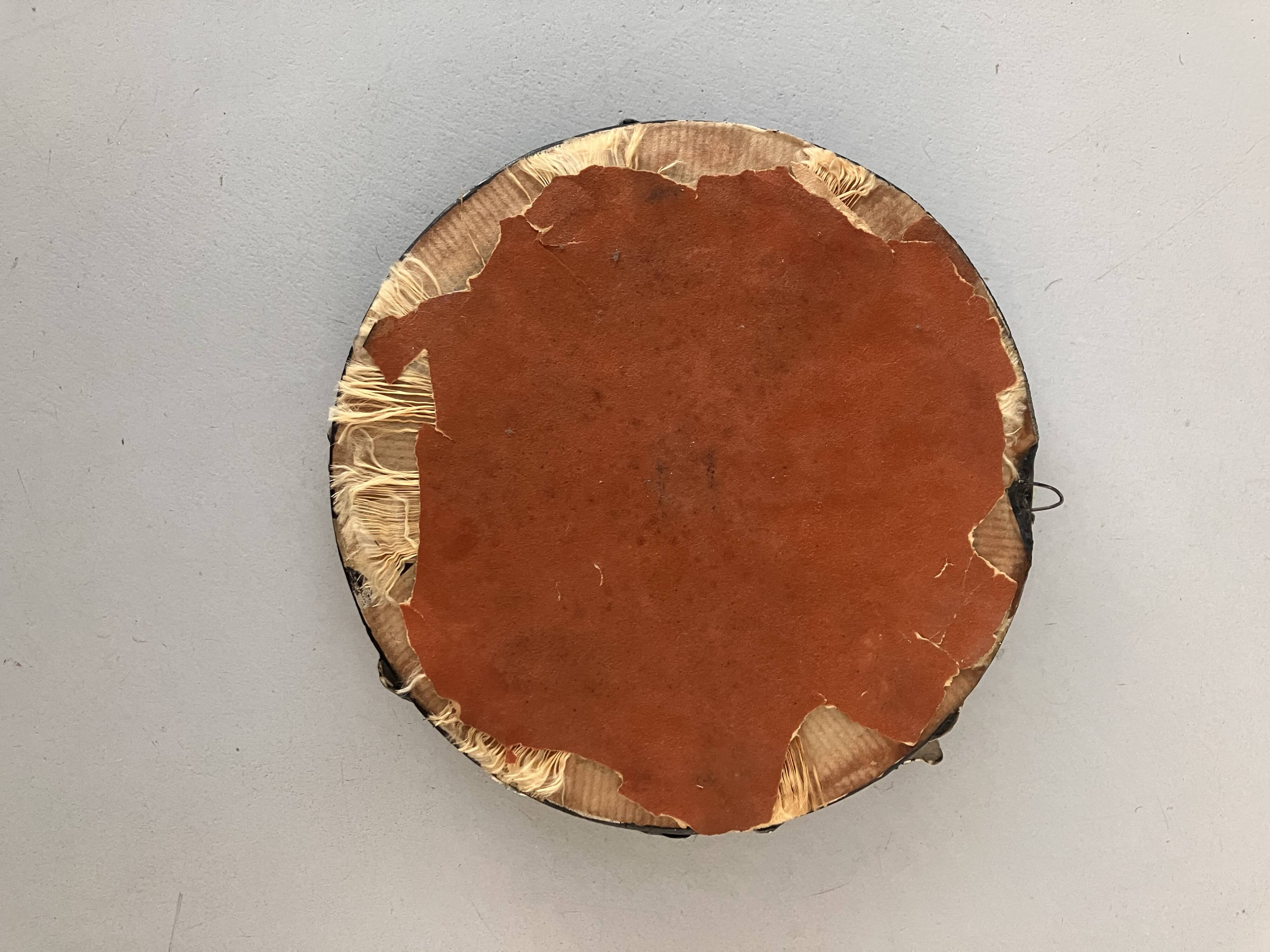 Round wall mirror in ceramic with slip-cast flowers, glazed, from the 60s/70s.