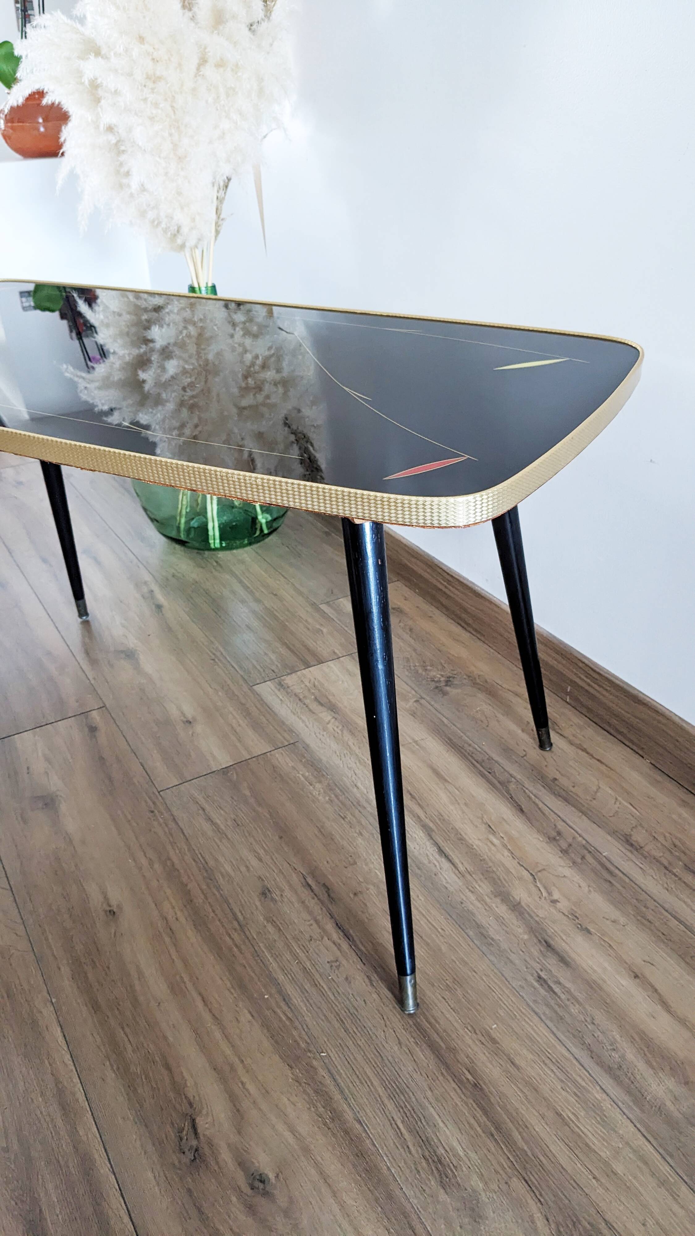 Glass coffee table with spindle legs