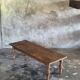 Brown Indonesian teak coffee table, with a border and cylindrical legs H40 L103.