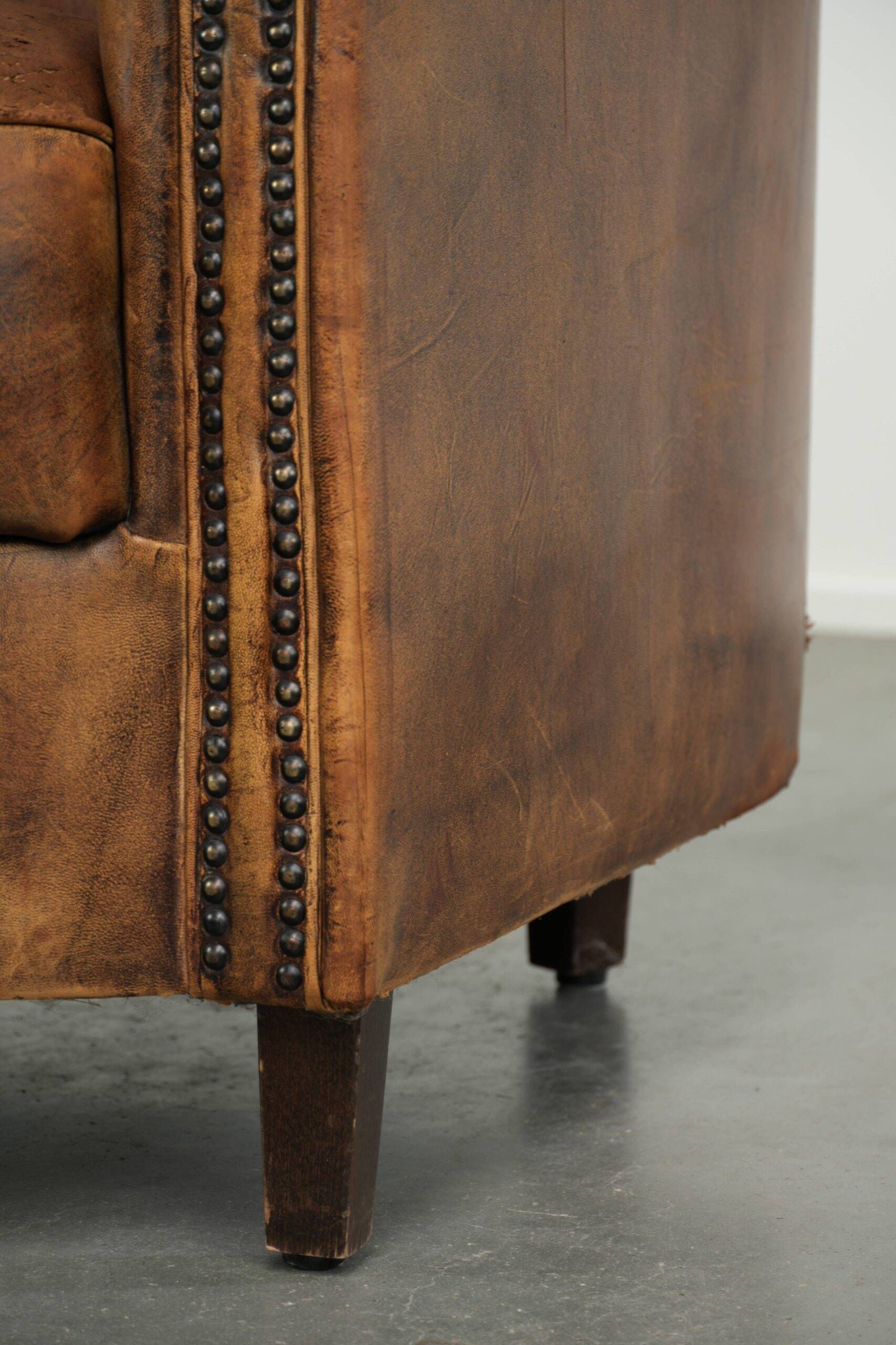 Vintage sheepskin clubchair in a beautiful cognac colour with a sturdy look