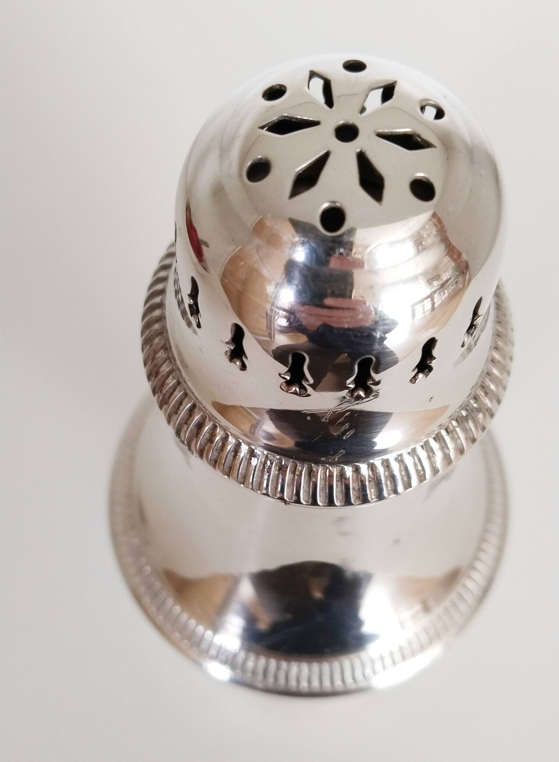 Silver-plated sugar shaker with fluted edges