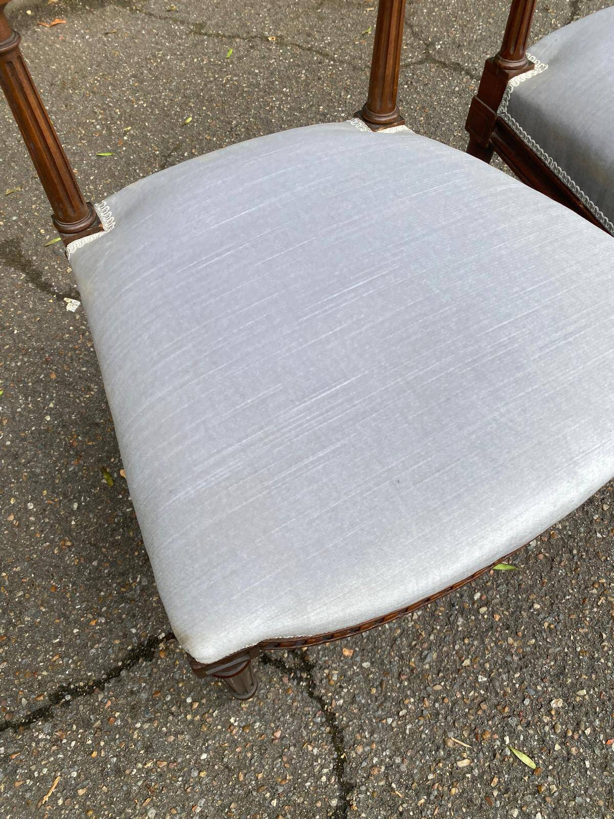 2 Louis XVI period chairs in solid wood and grey fabric.