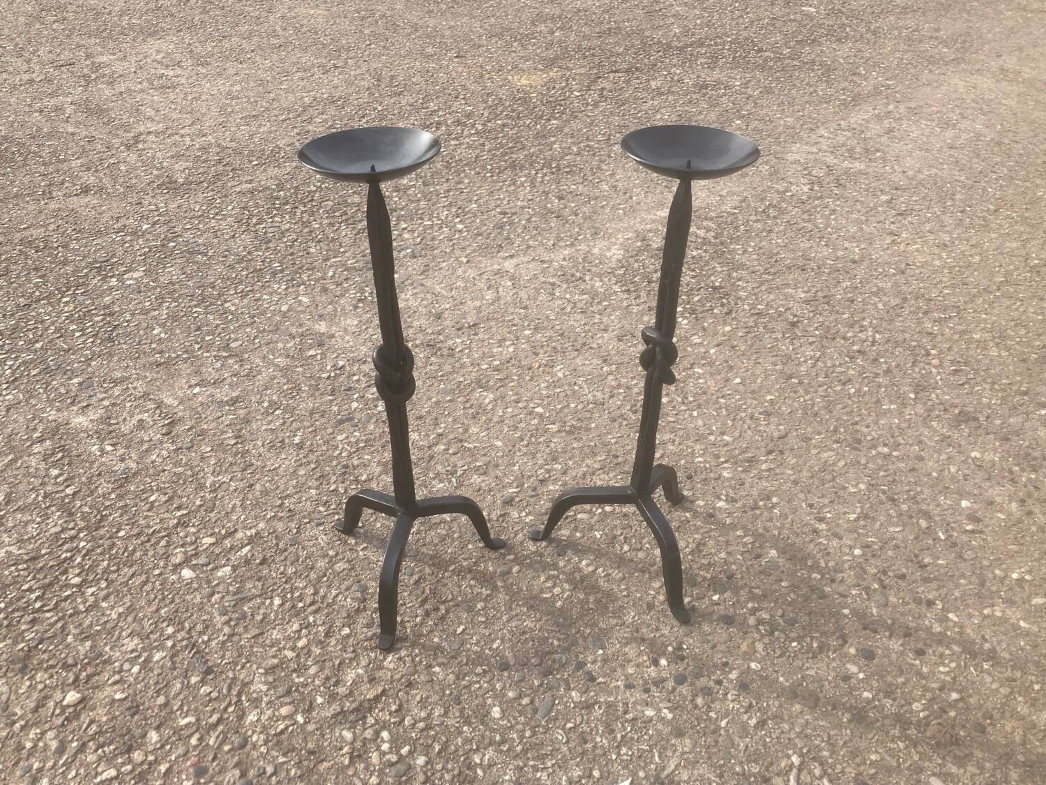 Pair of wrought iron candlesticks