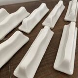 Vintage knife holders of 12, in white wave-shaped porcelain