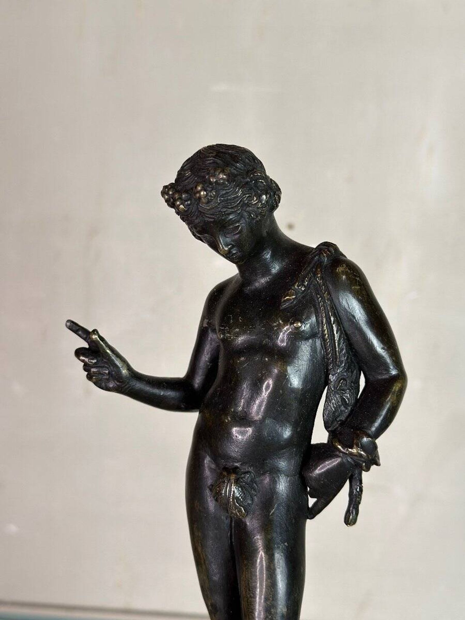 Narcissus, bronze after the antique on a wooden base, circa 1880.