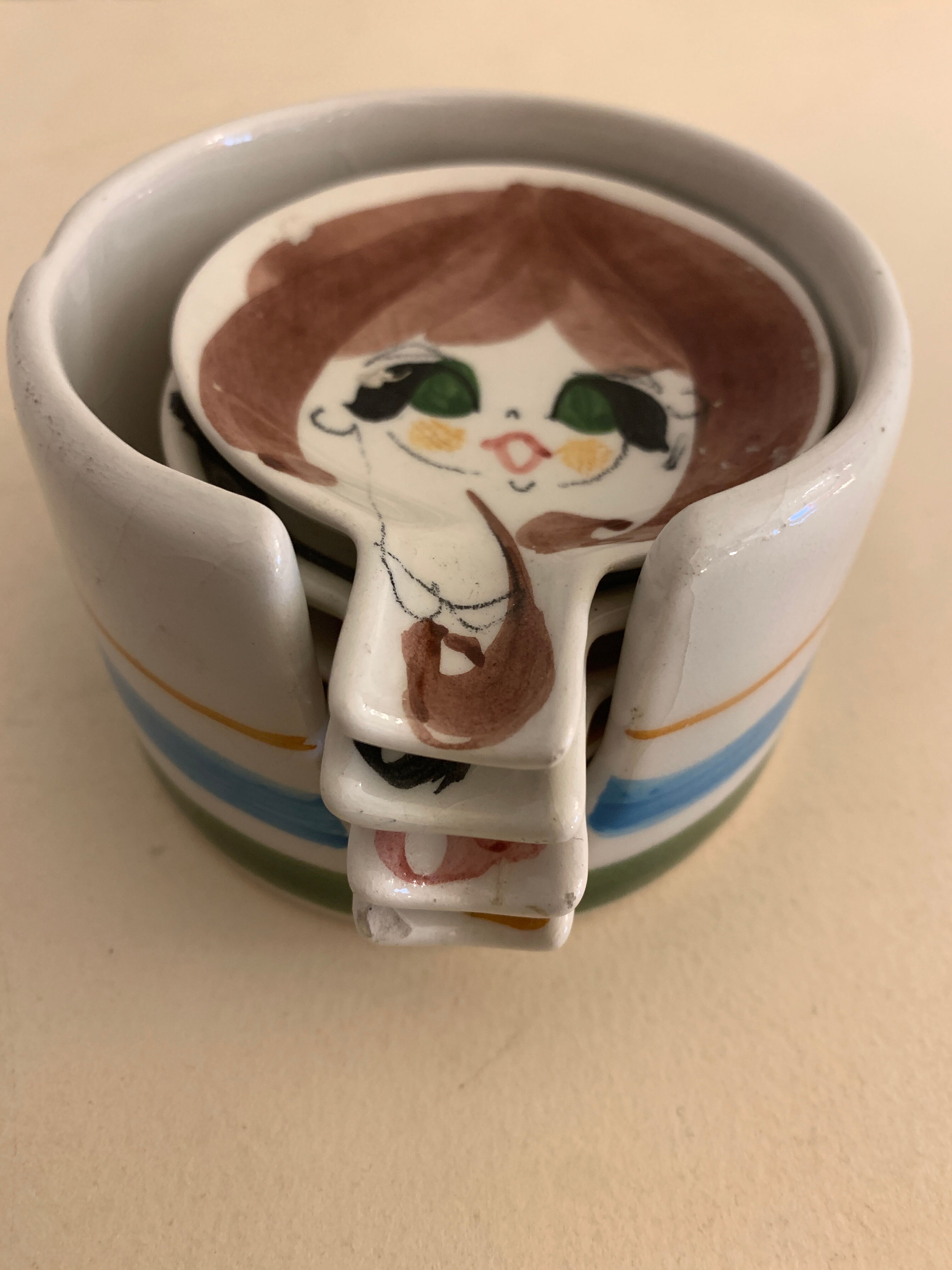 4 individual Italian ceramic stackable ashtrays with women's faces