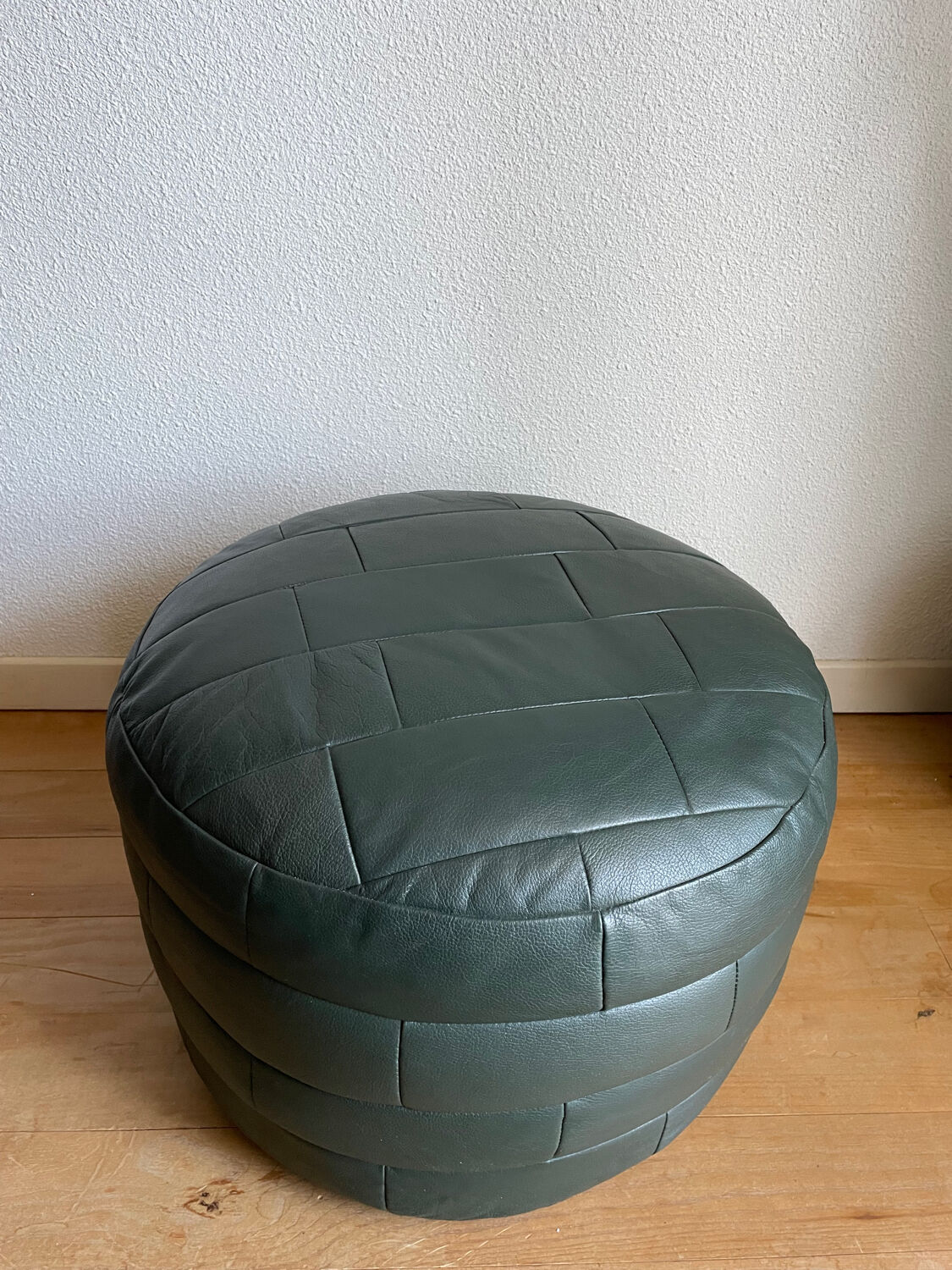 Green patchwork leather pouf from Sède