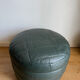 Green patchwork leather pouf from Sède
