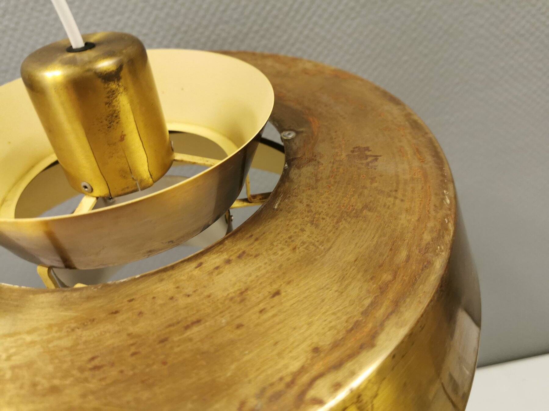 A mid-century Danish hanging lamp in solid brass by Jo Hammerborg for Fog & Mørup.