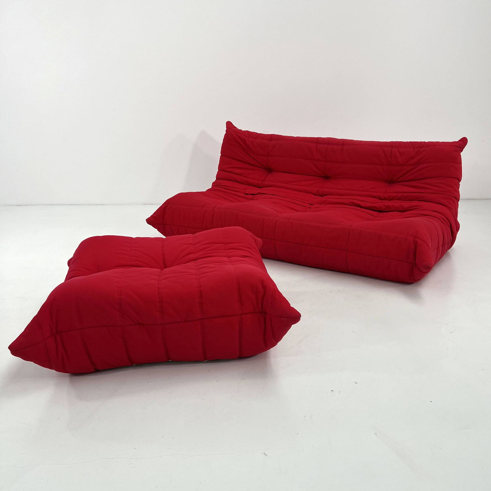 Togo 3-seater with red ottoman by Michel Ducaroy for Ligne Roset, 1970.